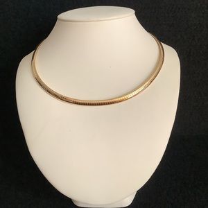 Gold tone omega necklace.( new old stock)